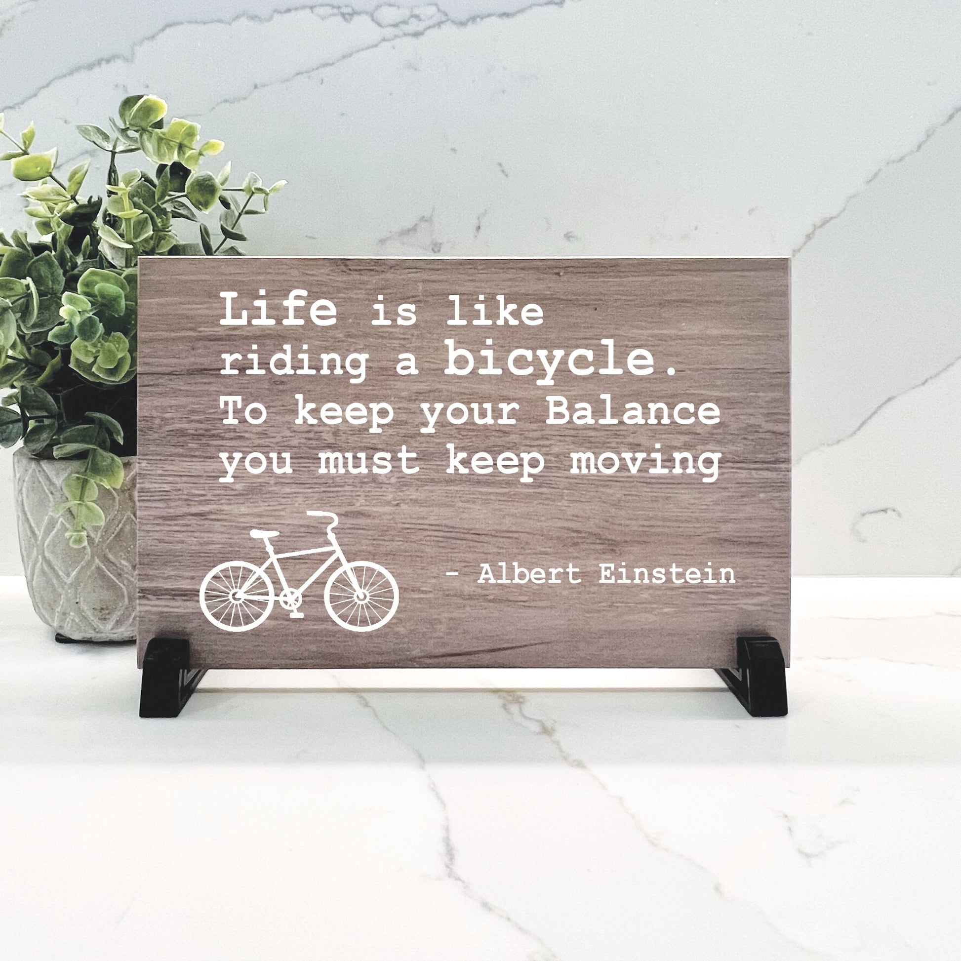 Life is like riding a bicycle. To keep your balance you must keep moving - Albert Einstein Quote - Choice of wood color - Inspirational sign
