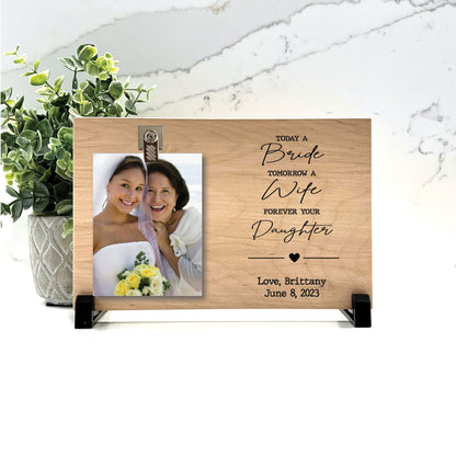 Customize your cherished moments with our Mother of the Bride Personalized Picture Frame available at www.florida-funshine.com. Create a heartfelt gift for family and friends with free personalization, quick shipping in 1-2 business days, and quality crafted picture frames, portraits, and plaques made in the USA."